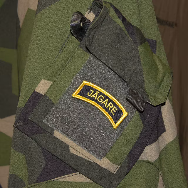 A Mounted JÄGARE Hook Patch Yellow/Black/Yellow on a M90 NCWR Jacket arm.