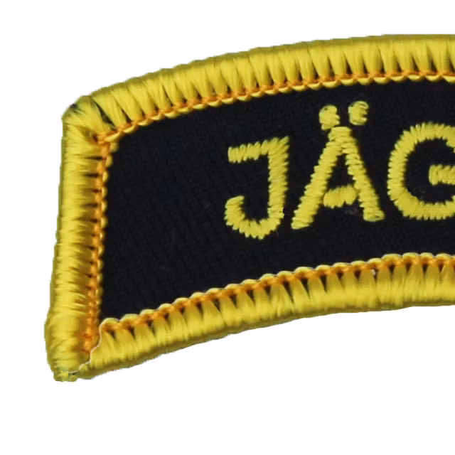 Close up of a JÄGARE Patch Yellow/Black/Yellow.