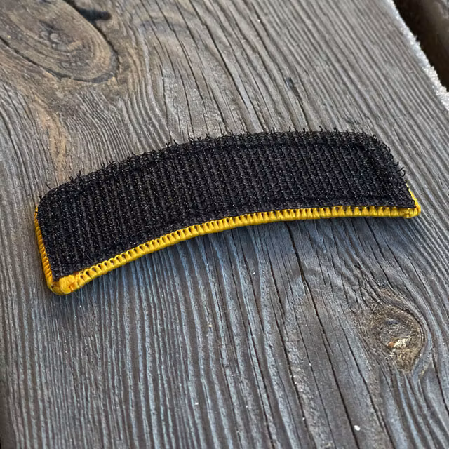 A closer look on the hook backing of a JÄGARE Hook Patch Orange/Black