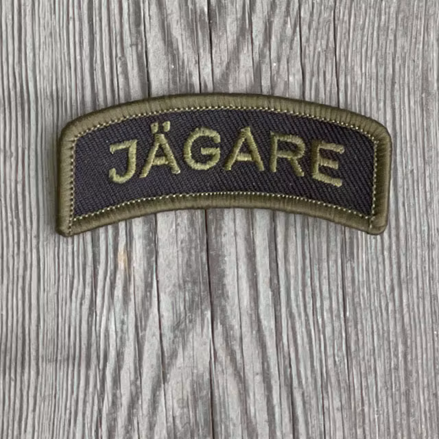 JÄGARE Sew On Patch Green/Black from TAC-UP GEAR seen from the front