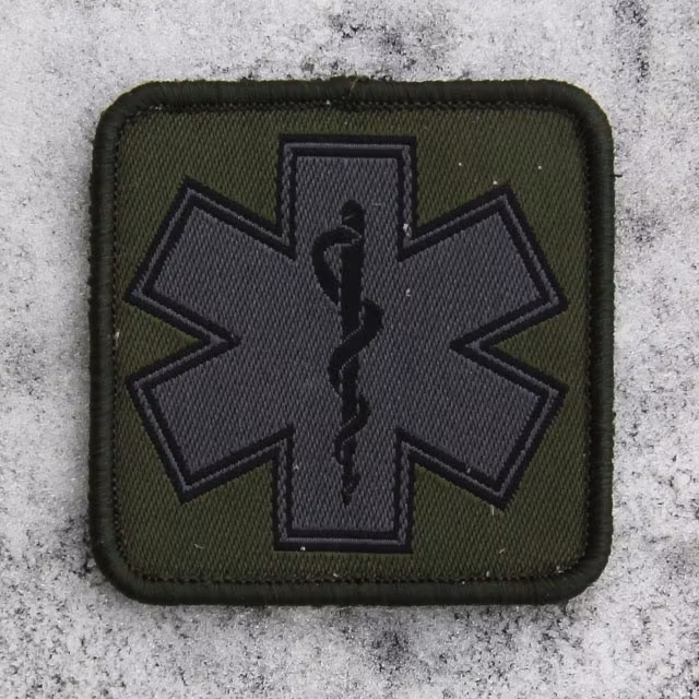 MEDIC Subdued Green Star Patch on frosty background.