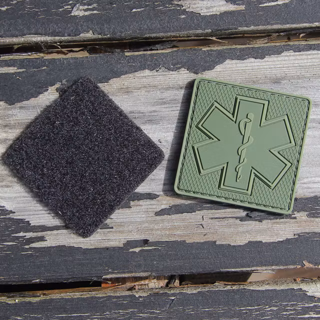 Separate loop backing and front of a MEDIC Subdued Green Star Hook PVC Patch.
