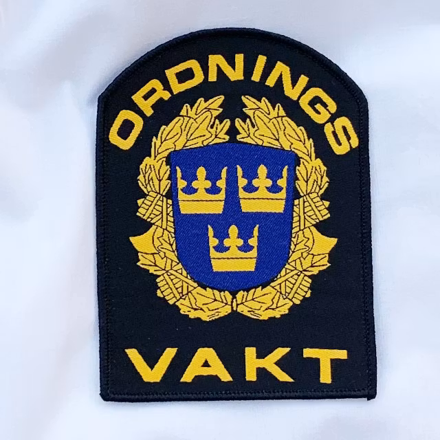 Ordningsvakt Rundad Tygmärke närbild