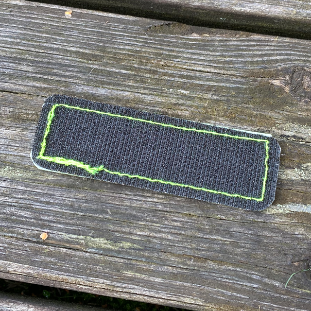 The hook backing of a Reflective Hook Patch Yellow