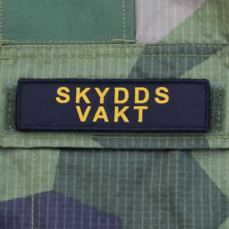 Skyddsvakt Bröstmärke Kardborre