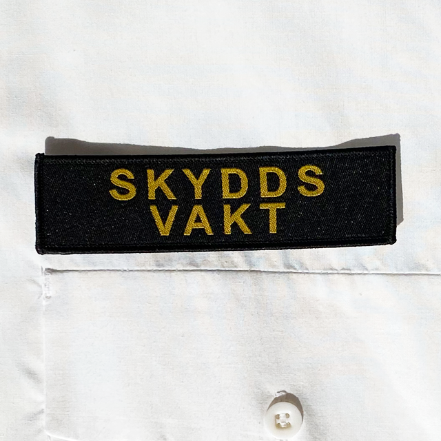 Skyddsvakt Avlångt Tygmärke att sy på tex en skjorta