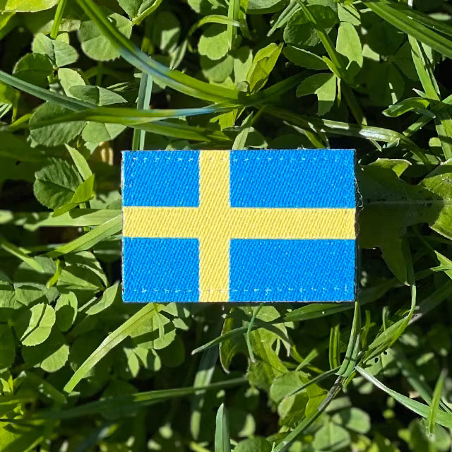 Sweden Flag Hook Patch Arm on the grass