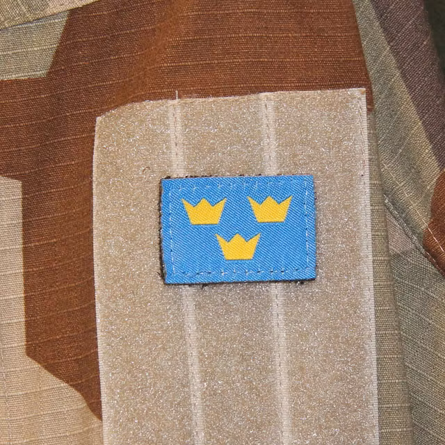Three Crowns Morale Patch with M90K Desert background.