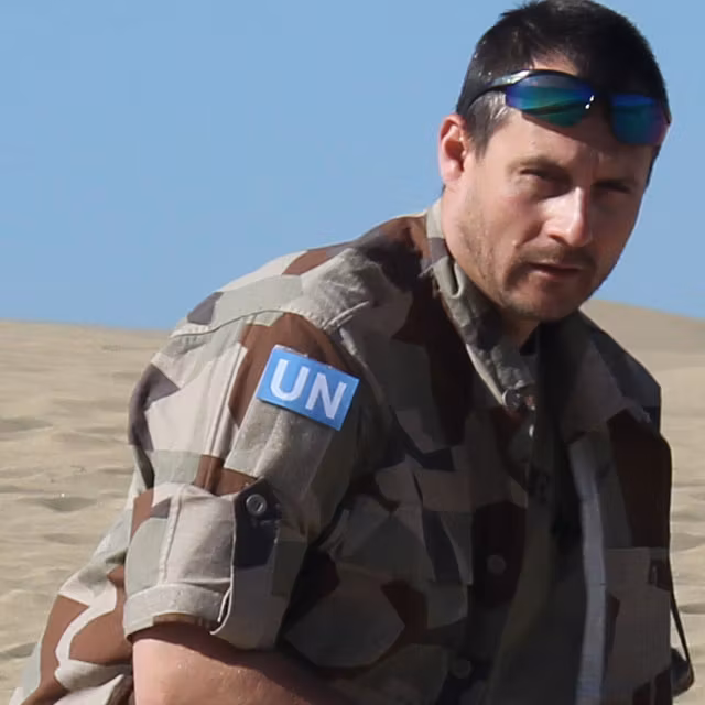 A United Nations Hook Patch Large worn in the desert during product photoshoot.