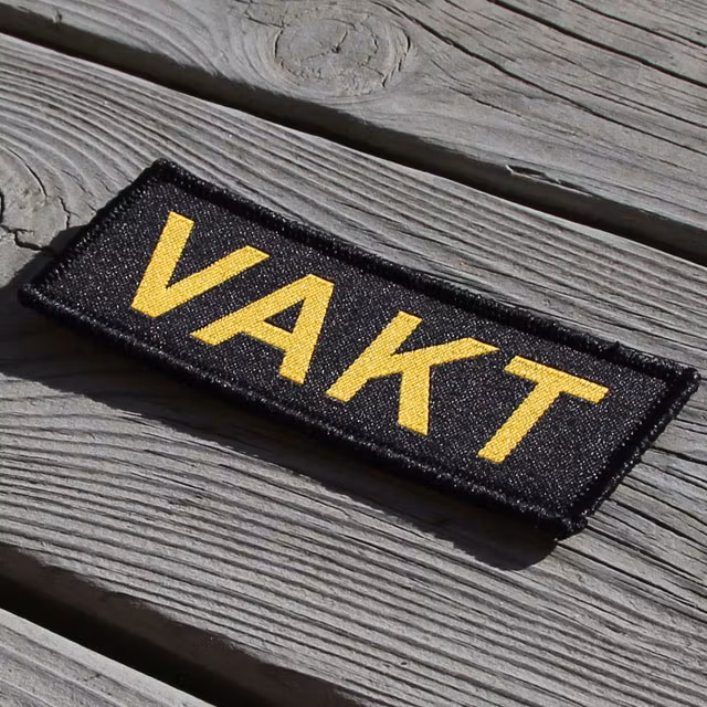 Produktfoto av ett VAKT Kardborremärke.