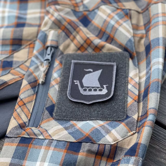 Viking Ship Shield Large Grey and Black Hook Patch mounted on an arm on a shirt