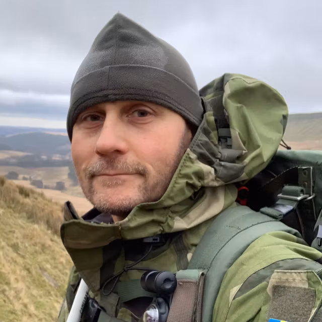 Recce Fleece Cap used over the clouds in mountain scenery