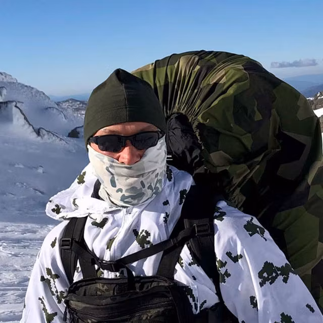 Recce Fleece Cap used in snowy mountains