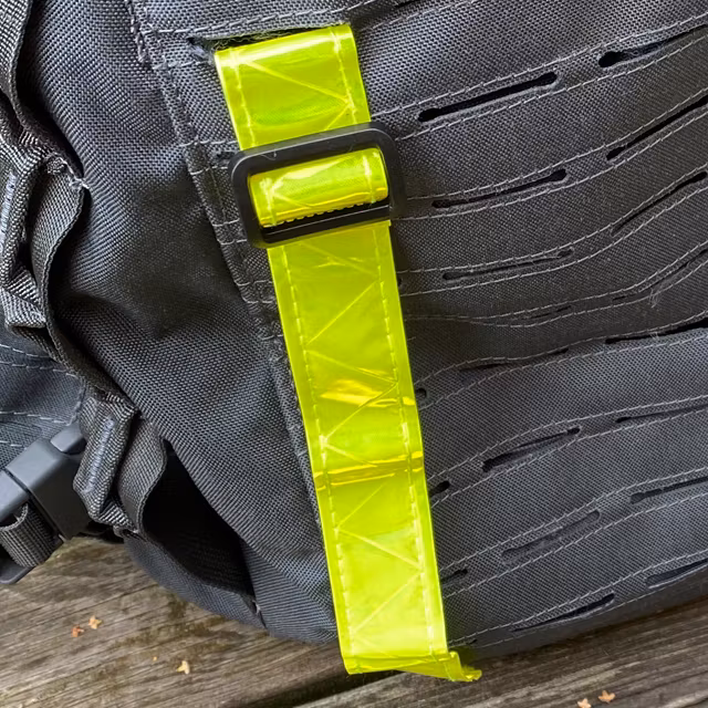 Showing one Reflective Stripe Yellow from the top mounted on a grey rucksack