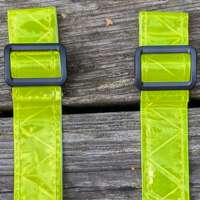 A pair of Reflective Stripes Yellow with its black plastic flatband locks