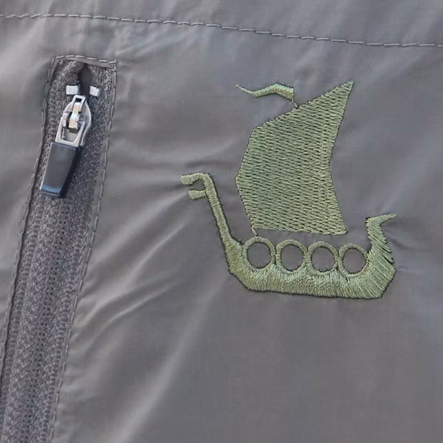 Longboat logo embroidered on a Running Jacket Green.
