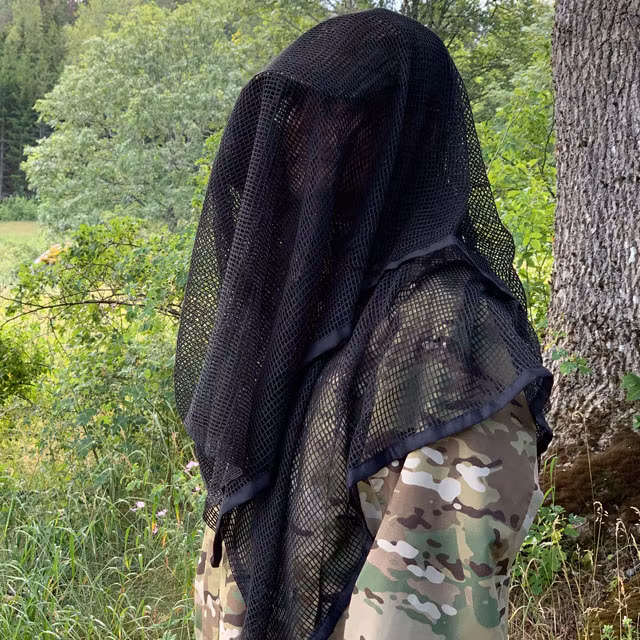 Face camouflaged by a Scrim Net Scarf Black