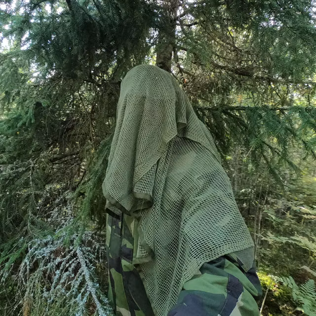 Scrim Net Scarf Green draped and in the Swedish forest