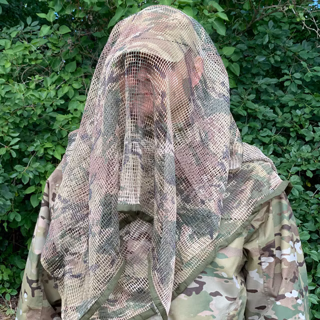 Draped model by a Scrim Net Scarf Multicam