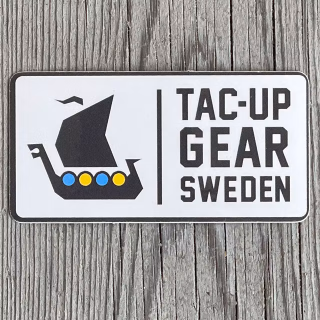 Sticker TUG Vit Gul Blå sedd framifrån