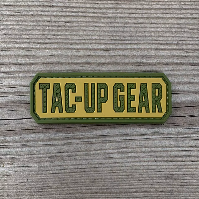 TAC-UP GEAR Multicam Style PVC Hook Patch mounted on a camouflage backpack
