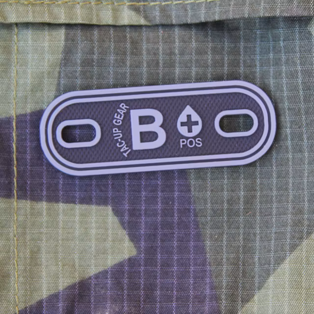 B+ Bloodtype Tag Black PVC with M90 background.