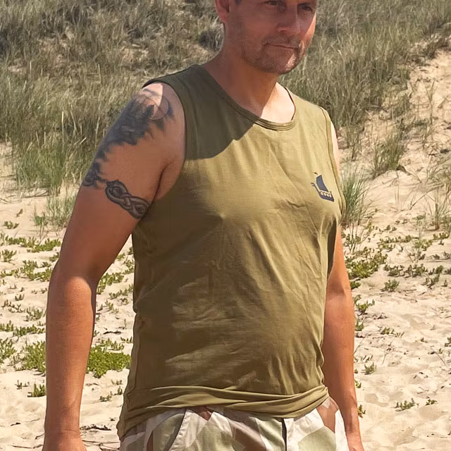 Tank Top Khaki Green from TAC-UP GEAR on model at the ocean seen from side front