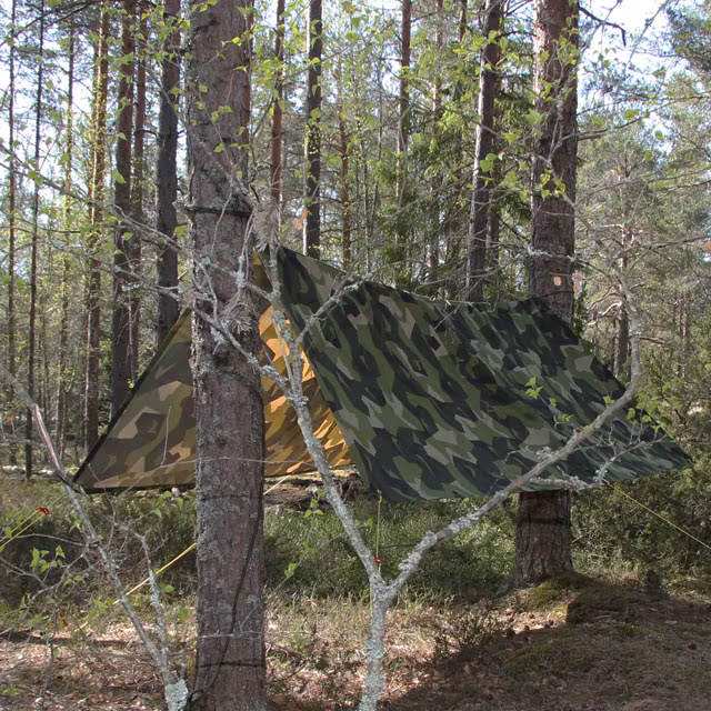 Tarp M90 Light set up as shield against the elements
