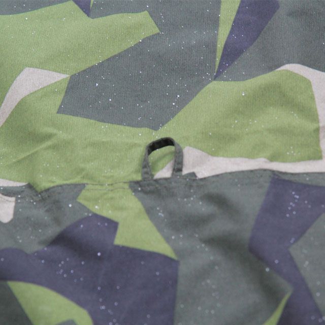 Loop on top of the Tarp Poncho M90 that can be used for hanging it up and making a roof for your camp.