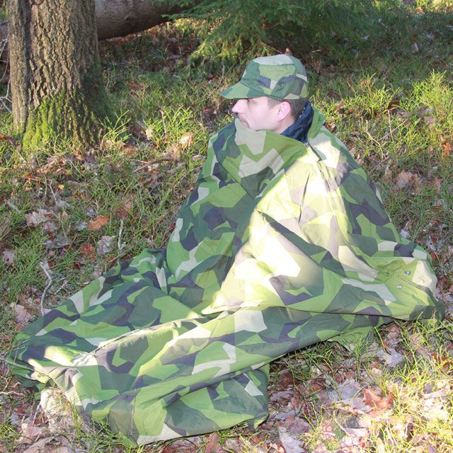 Using the zippers to create this tube to creep down in when using a Tarp Poncho M90.
