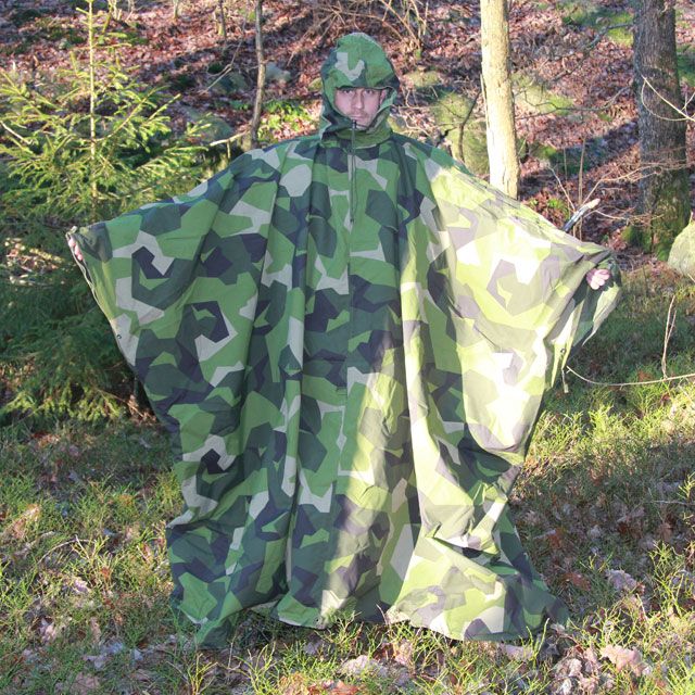 Tarp Poncho M90 used as a poncho and showing how large it is.