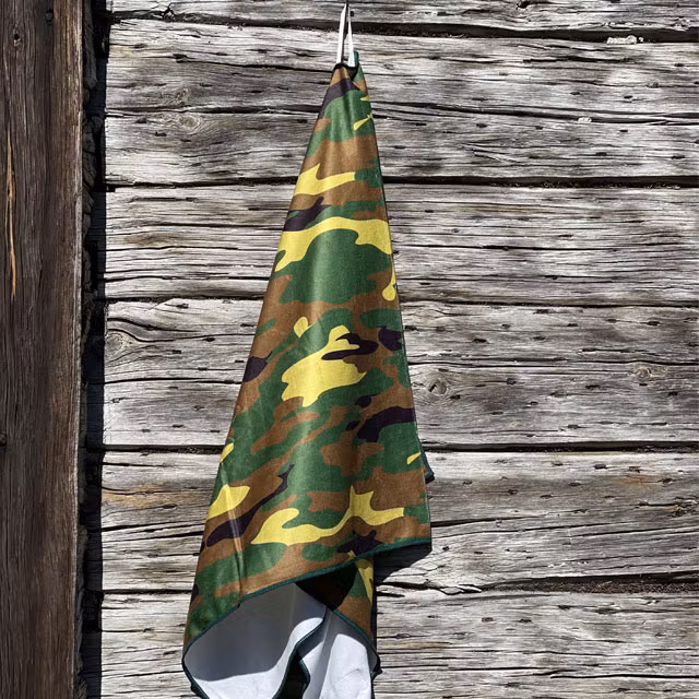 Closer look on a Towel Camouflage from TAC-UP GEAR hanging on a house wall