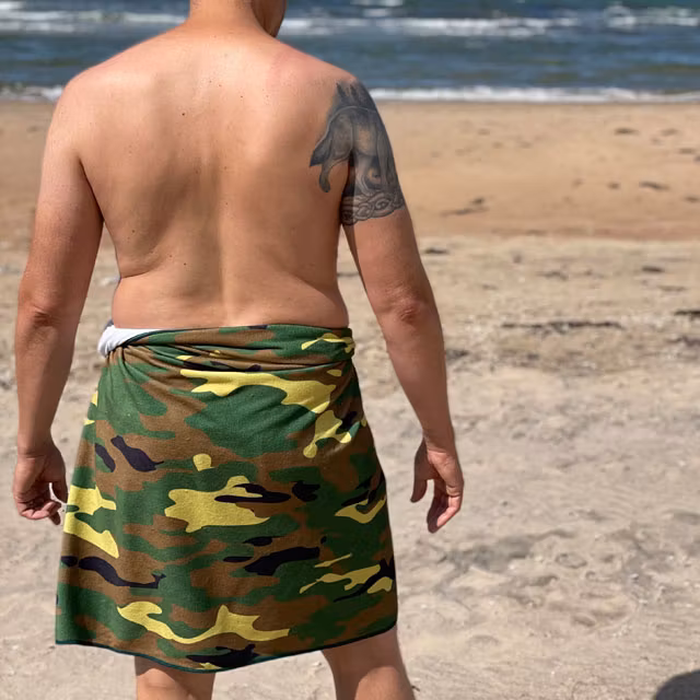 Towel Camouflage from TAC-UP GEAR wrapped around models waist on the beach
