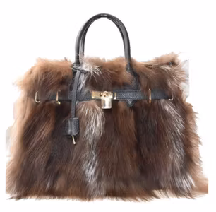 Esklusiv håndveske i skinn og fluffy pels
