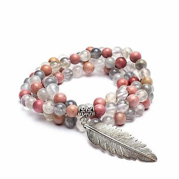 Grind rhodonite/gray quartz + feather