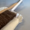 Litet tagelborstset med vit skyffel