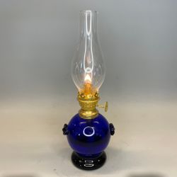 Mörkblå liten klotlampa i glas