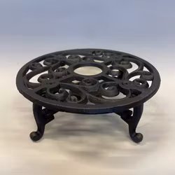 Grytunderlägg för värmeljus i järn