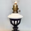 Bordsfotogenlampa i korgmodell på fot 10'''