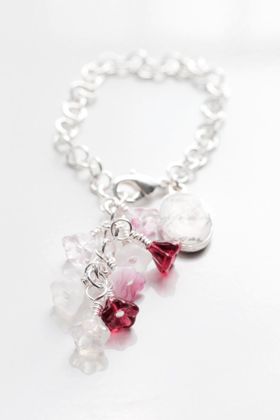 Armband med blommor och fotoberlock