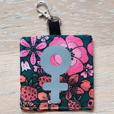 Reflex kvinnosymbol på rosa och rött blommigt nr.27