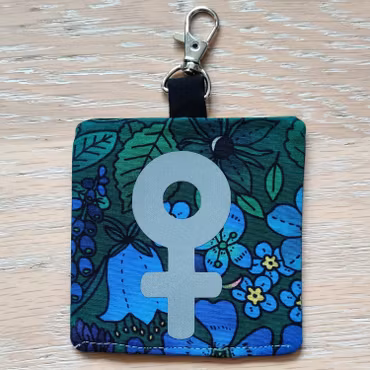 Reflex kvinnosymbol på grön och blå blommigt nr.29