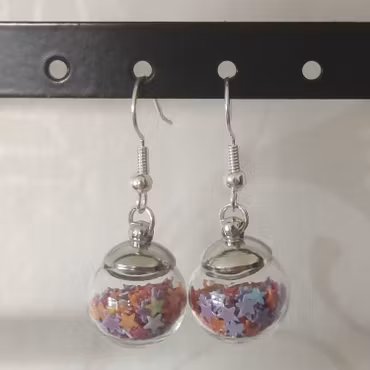 Örhängen glasglob med mix orange, lila och rött stjärnglitter