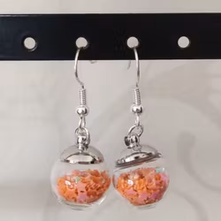 Örhängen glasglob med orange stjärnglitter
