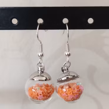 Örhängen glasglob med orange stjärnglitter