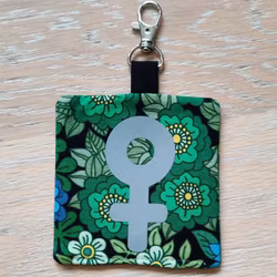 Reflex kvinnosymbol på grön och blå blommigt nr.22