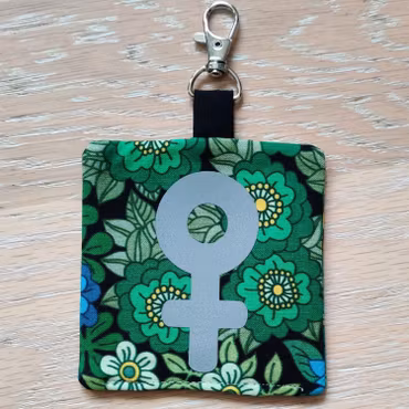 Reflex kvinnosymbol på grön och blå blommigt nr.22