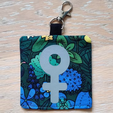 Reflex kvinnosymbol på grön och blå blommigt nr.29