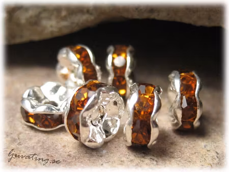 Silvrig rondell med topaz Rhinestone ca 6 mm