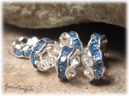 Silvrig rondell med blå Rhinestone ca 6 mm
